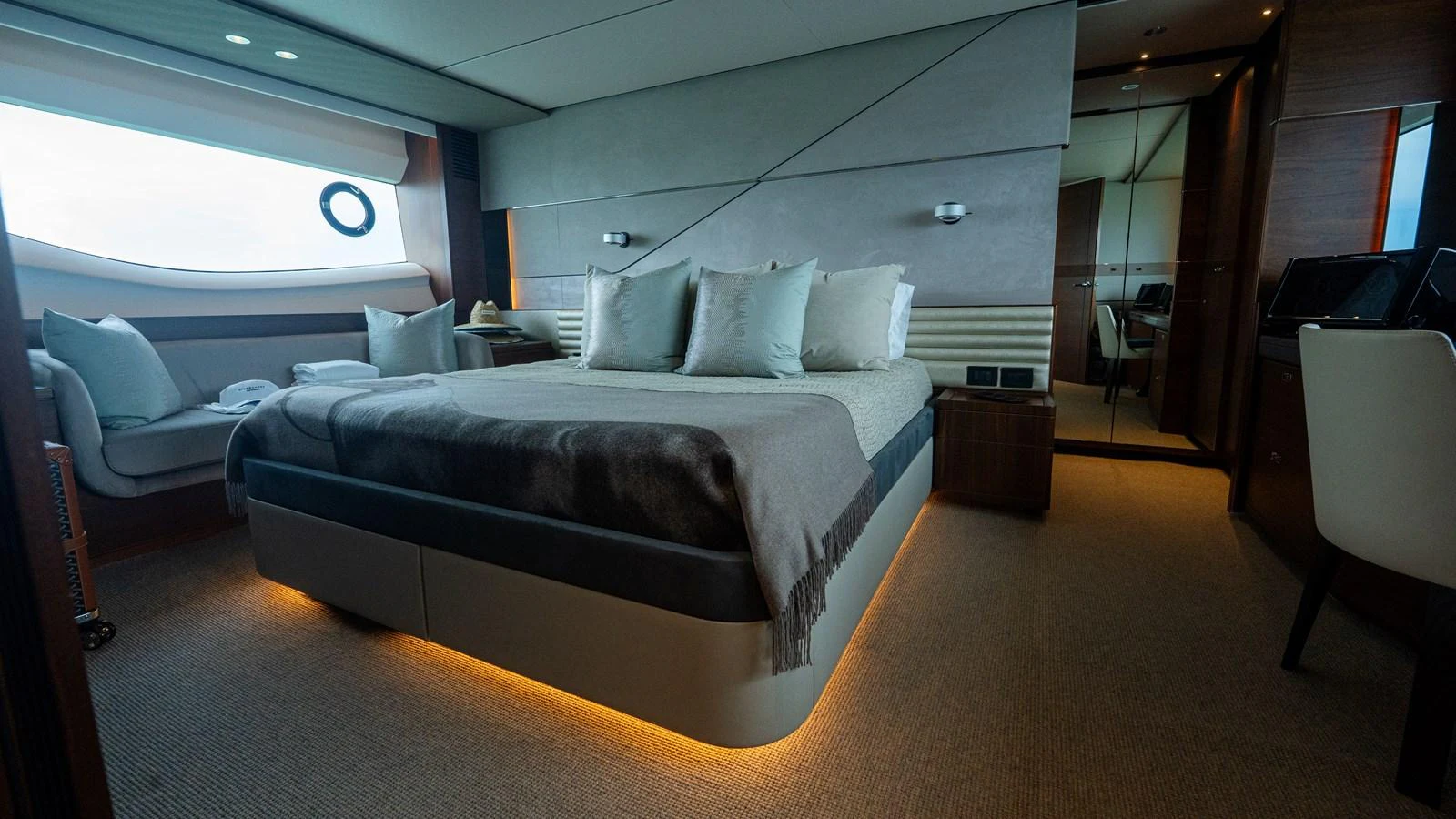 The master stateroom features a luxurious bed with ambient lighting and modern decor. aboard PARAGON Yacht for Sale