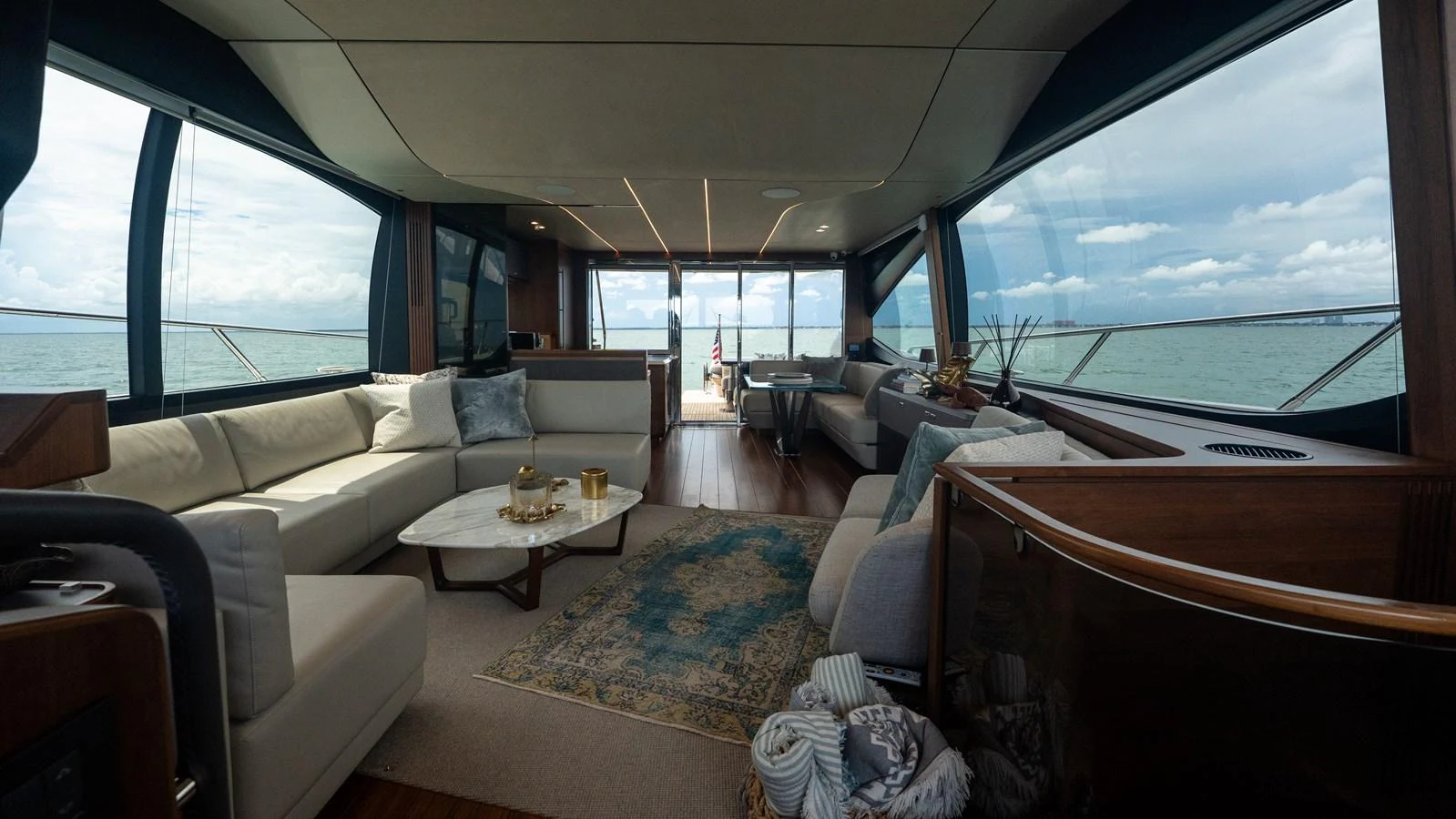 The salon offers a spacious and luxurious seating area with panoramic views of the sea. aboard PARAGON Yacht for Sale
