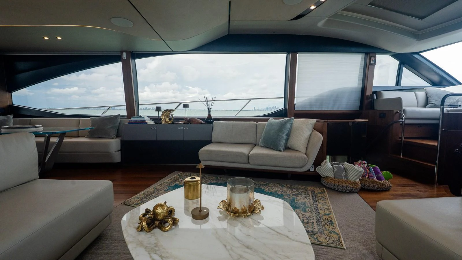 The salon offers a luxurious and comfortable space with panoramic views and elegant decor. aboard PARAGON Yacht for Sale