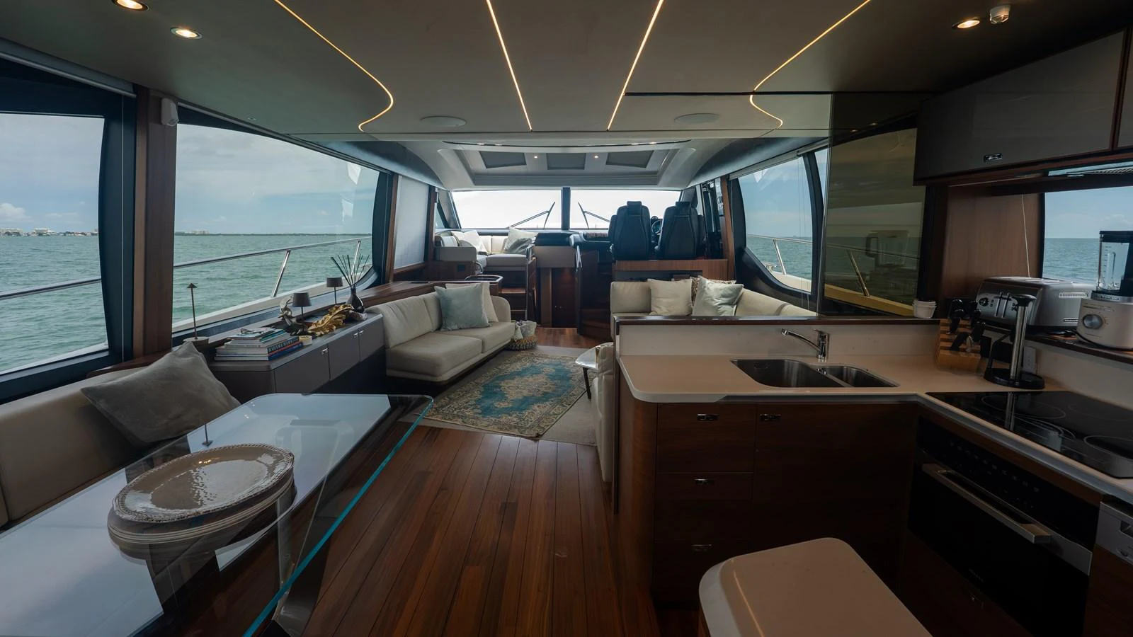 The yacht's salon features a spacious and modern design with ample seating and a well-equipped galley. aboard PARAGON Yacht for Sale