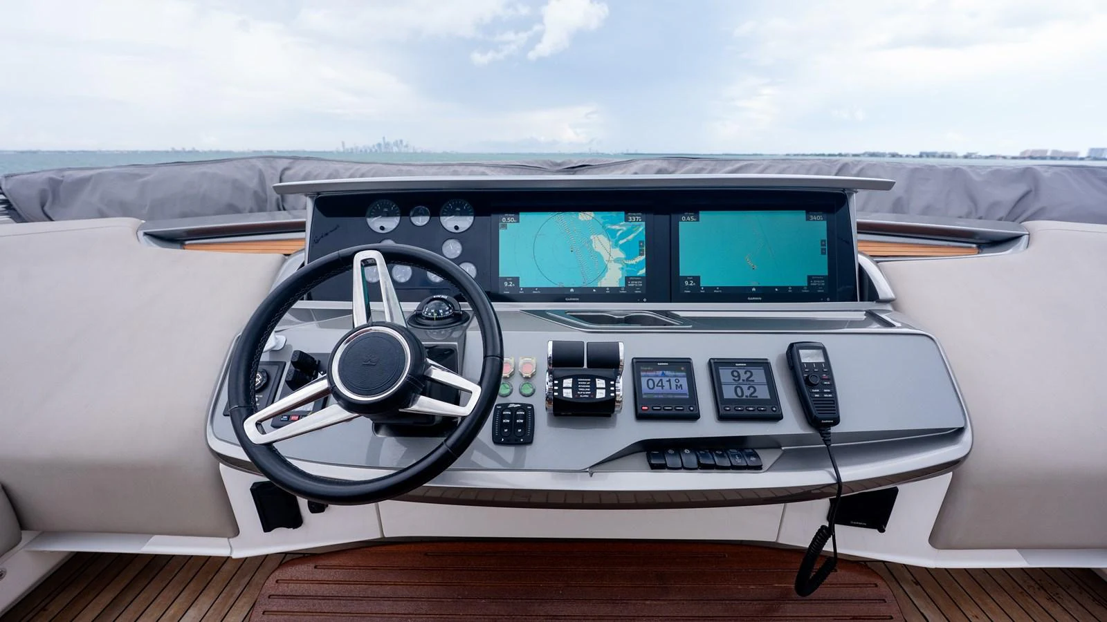 The helm station features advanced navigation equipment and a sleek steering wheel, offering a commanding view for the captain. aboard PARAGON Yacht for Sale