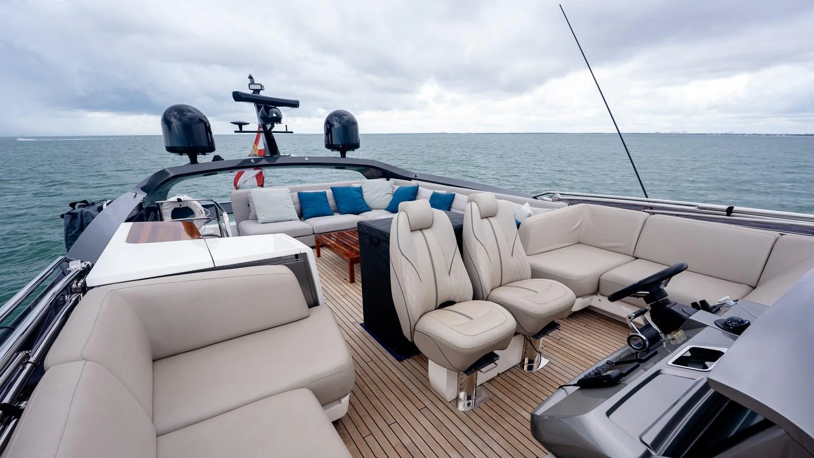 The flybridge offers a spacious and luxurious seating area with panoramic ocean views. aboard PARAGON Yacht for Sale