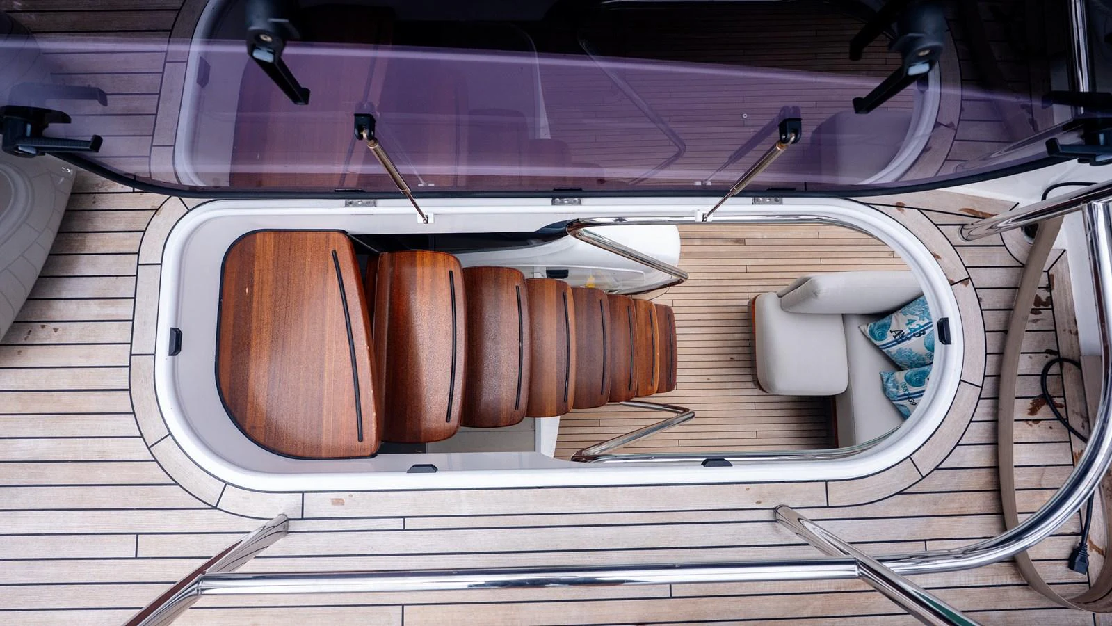 A beautifully crafted wooden staircase leads from the deck to the interior of the yacht. aboard PARAGON Yacht for Sale
