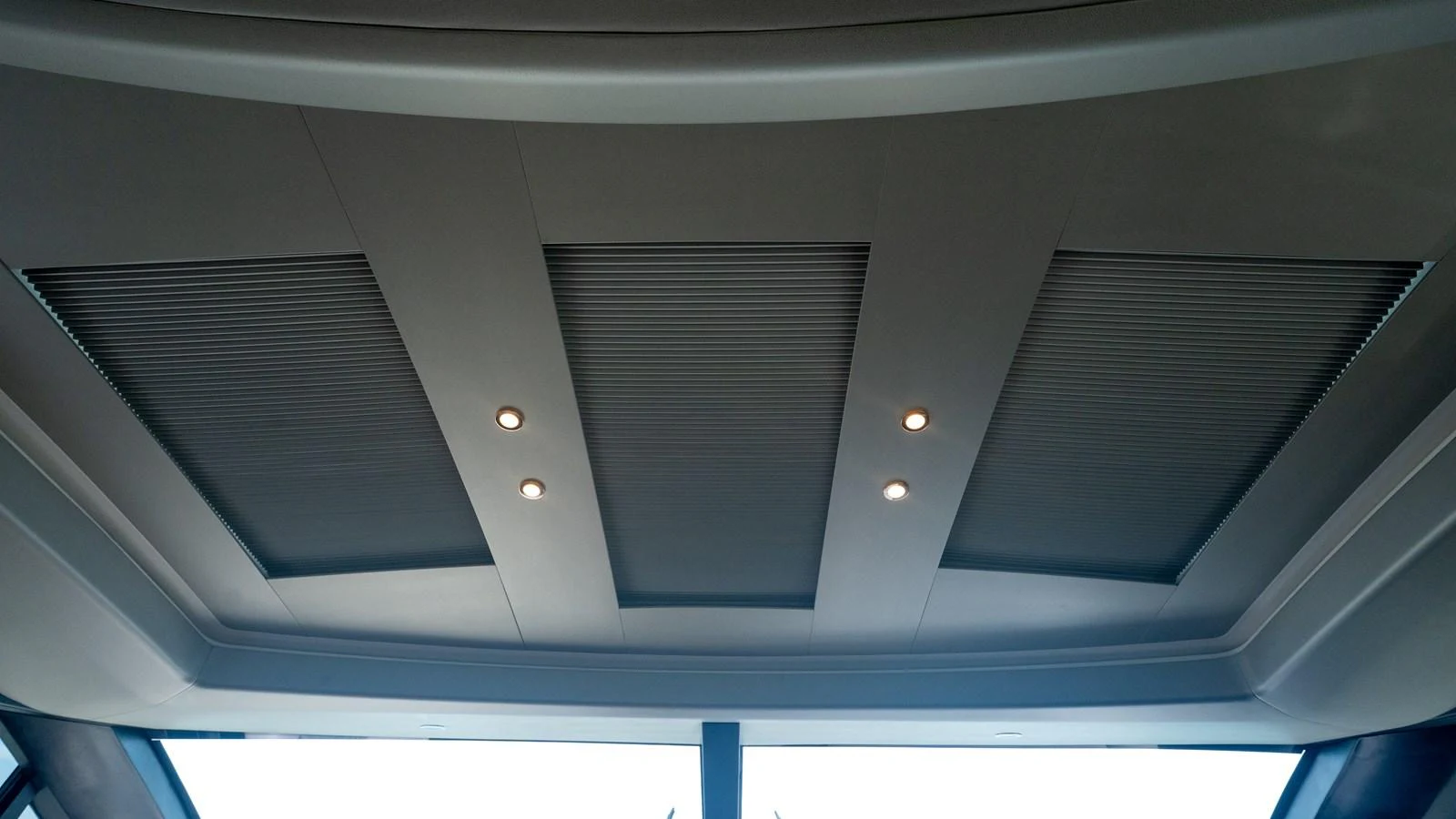 The image showcases a sleek and modern ceiling design with integrated lighting. aboard PARAGON Yacht for Sale