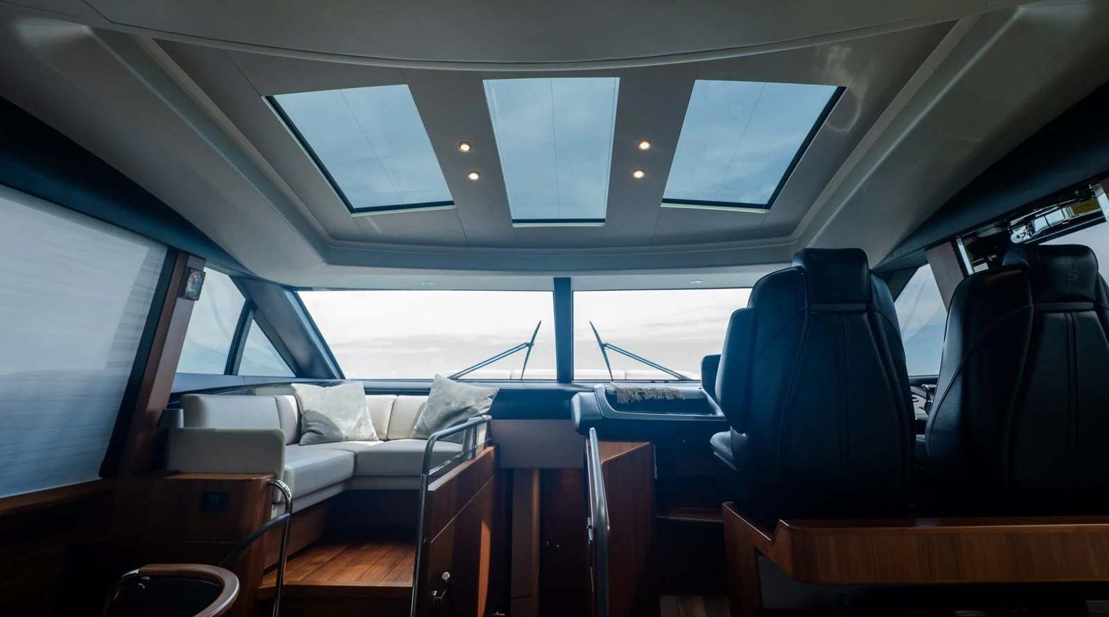 The helm area features luxurious seating and large skylights for an open, airy feel. aboard PARAGON Yacht for Sale
