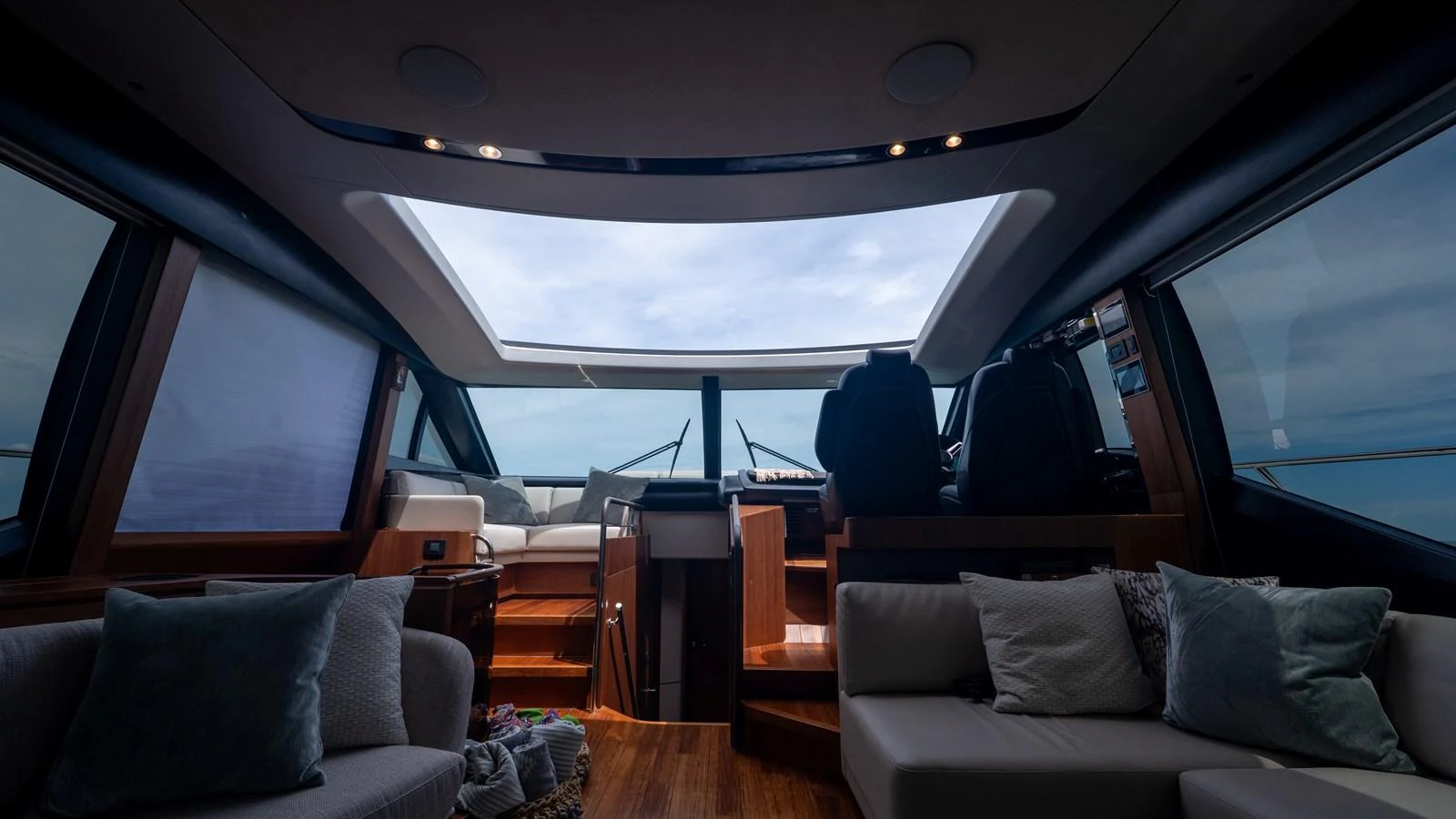 The yacht's helm area features a modern design with ample seating and large windows for a panoramic view. aboard PARAGON Yacht for Sale
