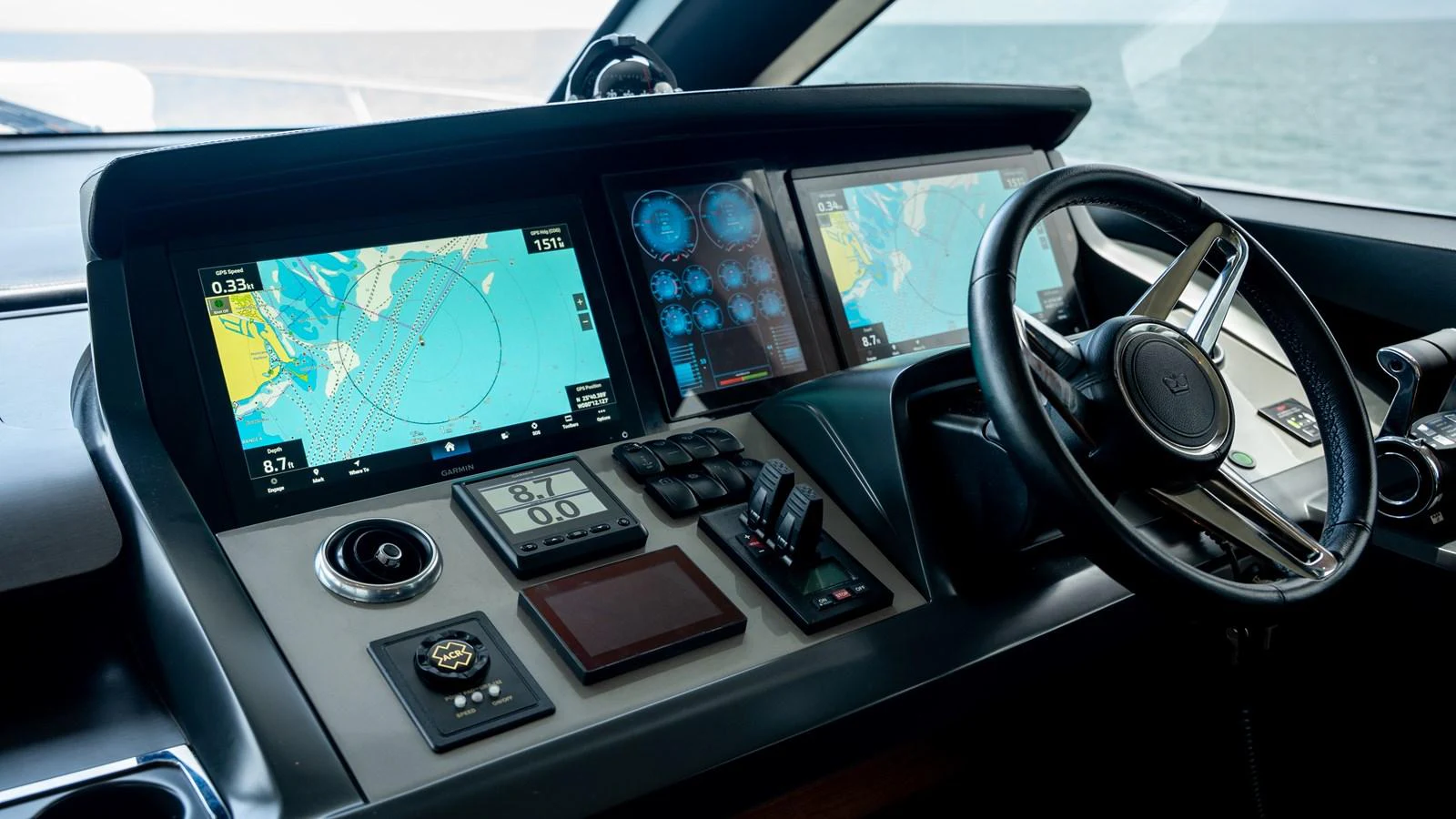 The helm station features advanced navigation equipment and a sleek steering wheel. aboard PARAGON Yacht for Sale