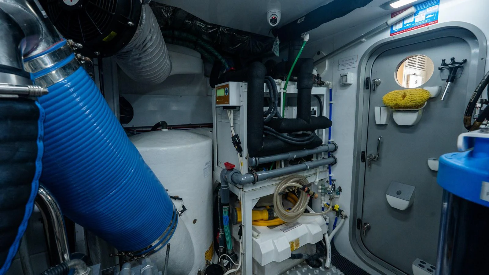 The image showcases the yacht's well-maintained engine room with various mechanical components and equipment. aboard PARAGON Yacht for Sale