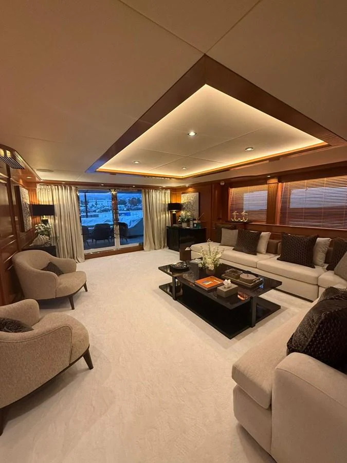 The salon offers a luxurious and comfortable seating area with elegant decor and ample natural light. aboard ULYSSES Yacht for Sale