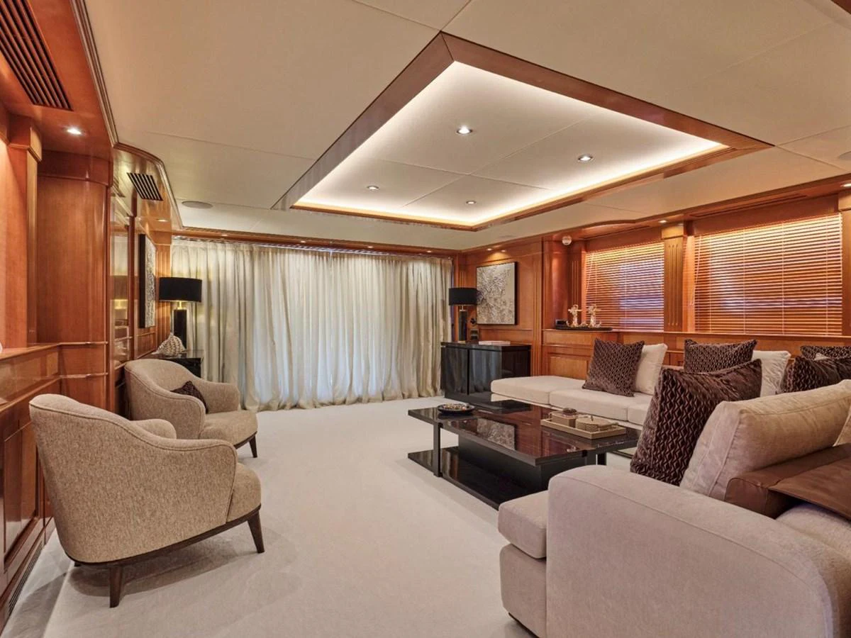 The salon features elegant seating and sophisticated lighting, creating a luxurious ambiance. aboard ULYSSES Yacht for Sale