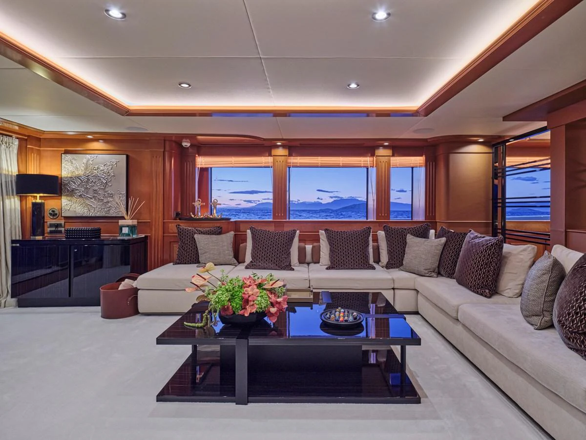 The salon features plush seating, elegant decor, and large windows offering stunning views. aboard ULYSSES Yacht for Sale