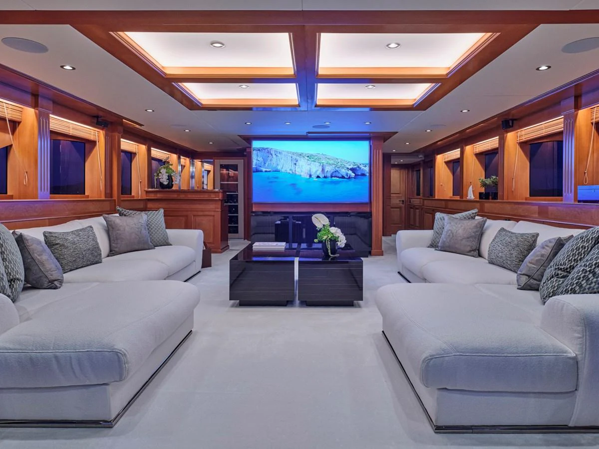 The spacious salon features plush seating and a large flat-screen TV, creating an inviting atmosphere for relaxation and entertainment. aboard ULYSSES Yacht for Sale