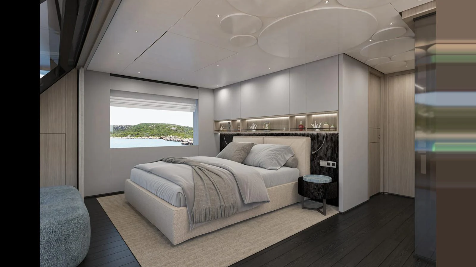 The master stateroom features a luxurious bed with modern decor and a scenic view through the window. aboard MANDAYACHT E 09 Yacht for Sale