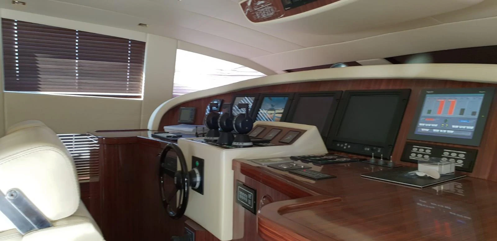 The helm station features advanced navigation equipment and luxurious wood finishes. aboard LEOPARD 105 FT Yacht for Sale