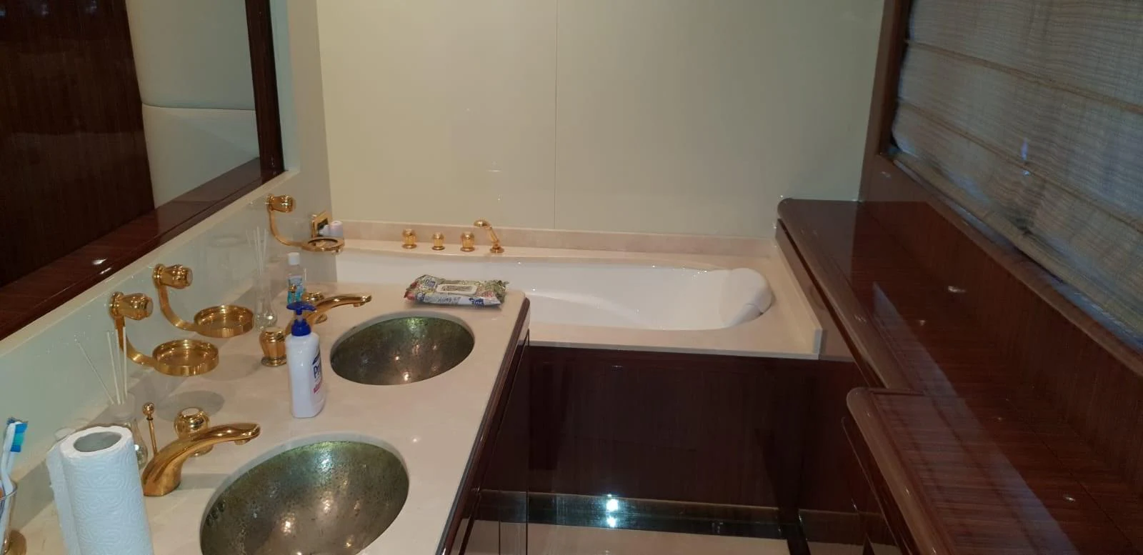 The yacht's bathroom features elegant fixtures and a spacious bathtub. aboard LEOPARD 105 FT Yacht for Sale
