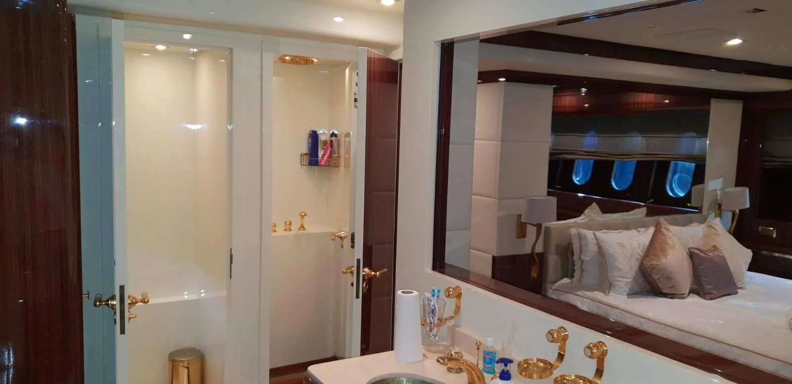 The master stateroom features a luxurious bed and an en-suite bathroom with elegant fixtures. aboard LEOPARD 105 FT Yacht for Sale