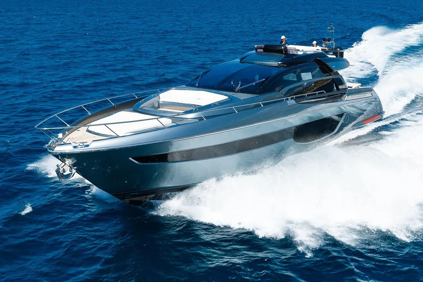 A sleek and modern yacht glides swiftly across the open sea, showcasing its elegant design and powerful performance. aboard ACQUA Yacht for Sale