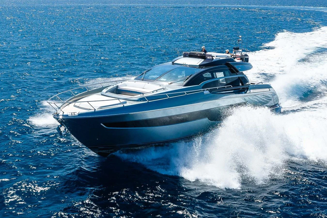 A sleek, modern yacht cruises swiftly through the open sea, showcasing its elegant design and powerful performance. aboard ACQUA Yacht for Sale