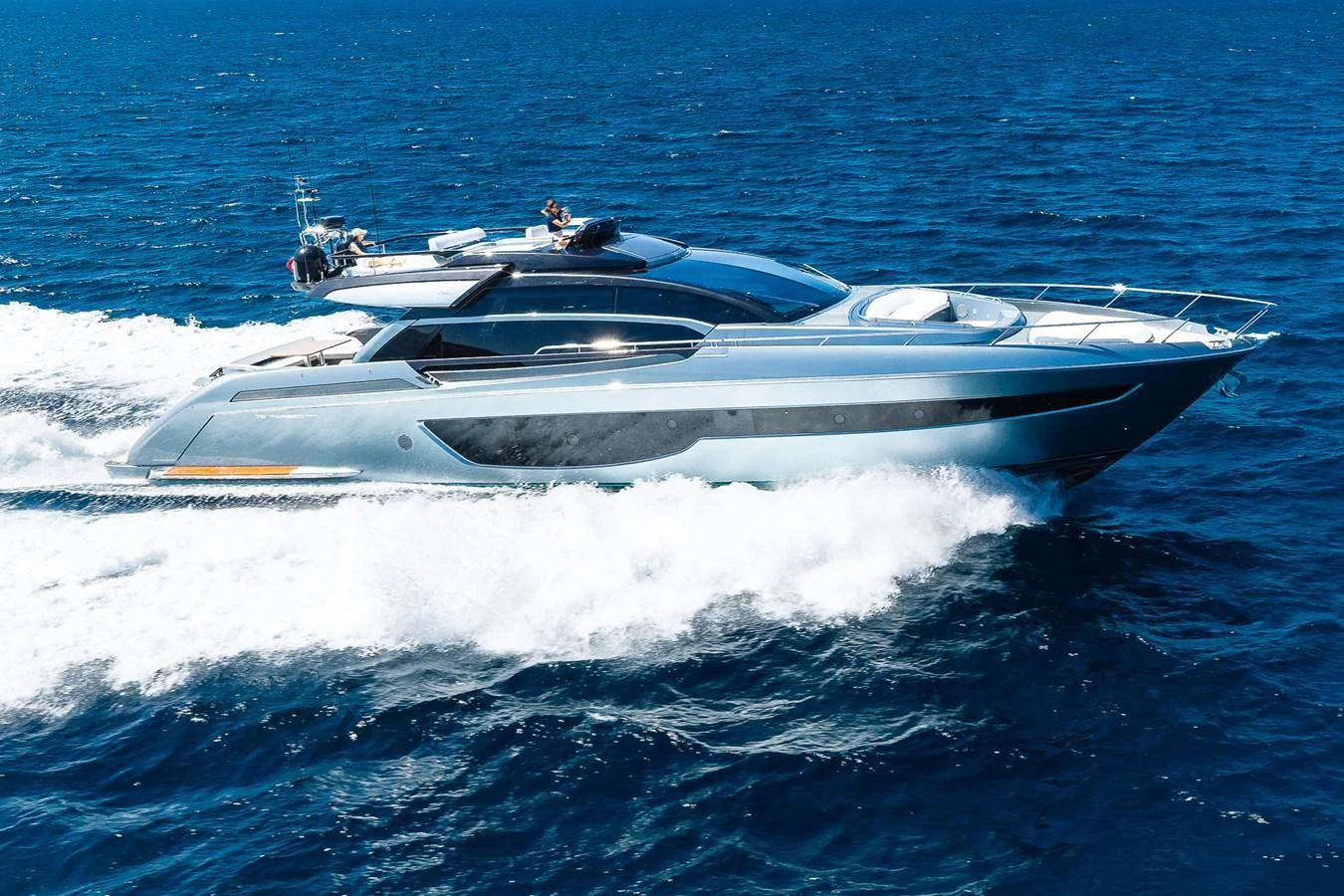 A sleek and modern yacht glides swiftly across the open sea, showcasing its elegant design and powerful performance. aboard ACQUA Yacht for Sale