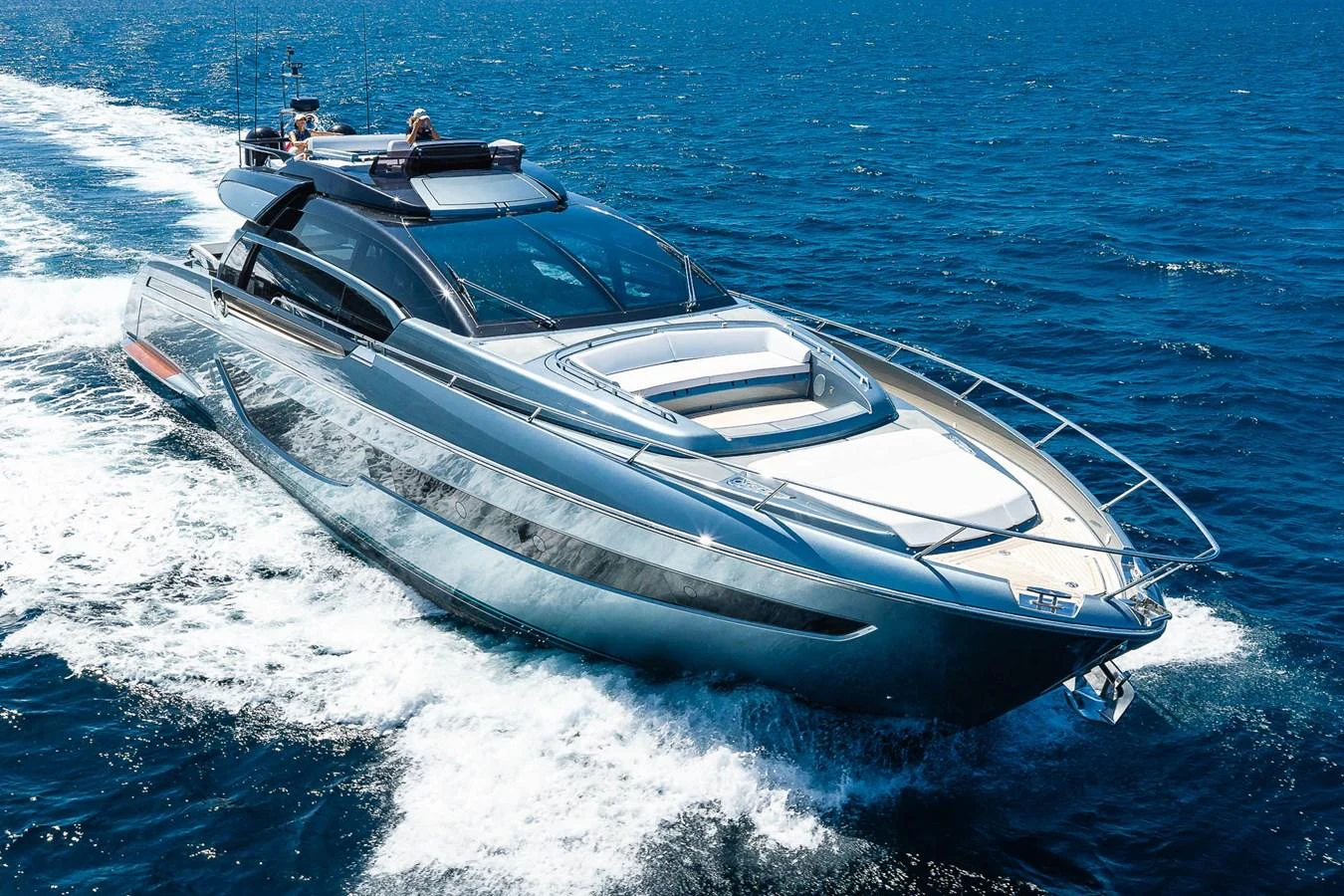 A sleek and modern yacht glides swiftly across the open sea, showcasing its luxurious design and powerful performance. aboard ACQUA Yacht for Sale
