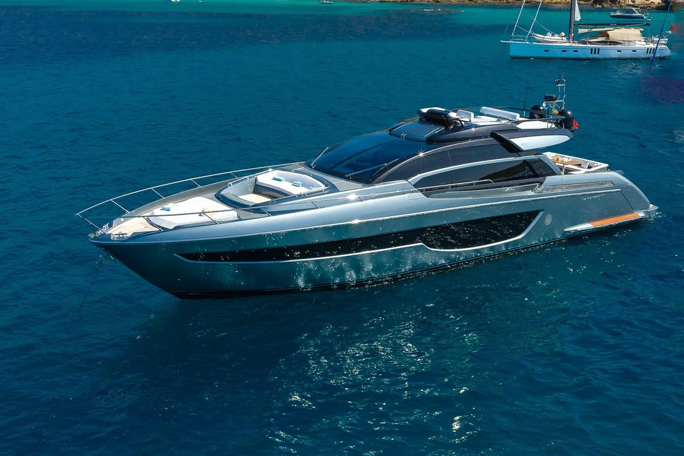 A sleek and modern yacht glides gracefully on the azure waters. aboard ACQUA Yacht for Sale