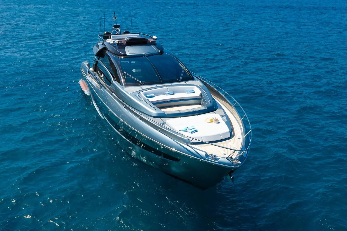 A sleek and modern yacht glides gracefully on the open sea, showcasing its elegant design and luxurious features. aboard ACQUA Yacht for Sale
