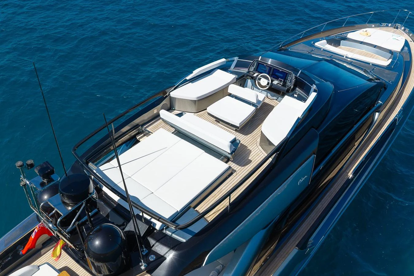 The yacht's flybridge offers a spacious and luxurious lounging area with ample seating and modern amenities. aboard ACQUA Yacht for Sale