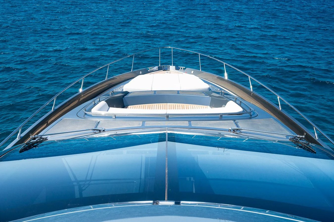 The yacht's sleek bow cuts through the deep blue waters, showcasing its modern design. aboard ACQUA Yacht for Sale
