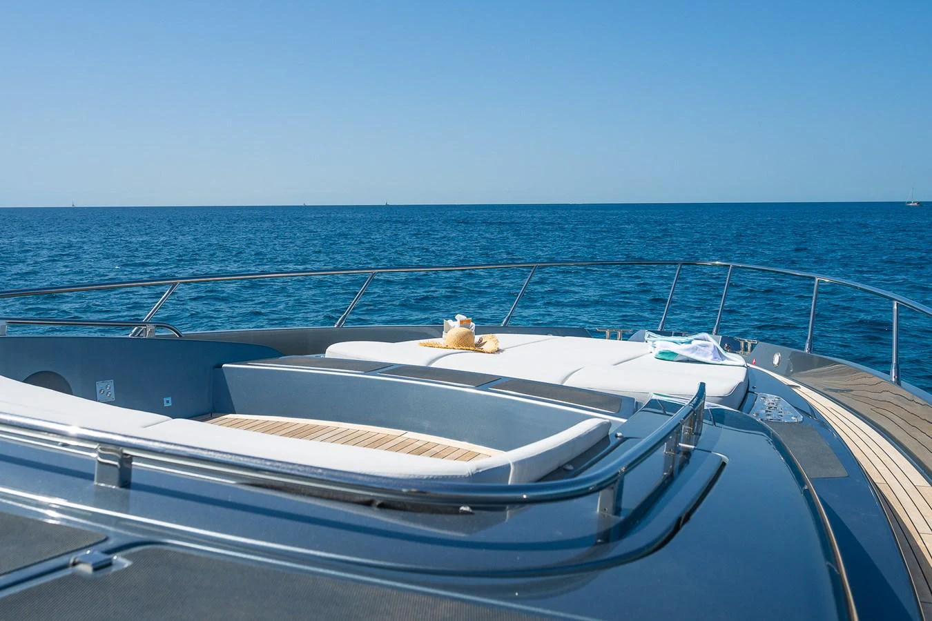 The yacht's foredeck offers a luxurious sunbathing area with stunning ocean views. aboard ACQUA Yacht for Sale