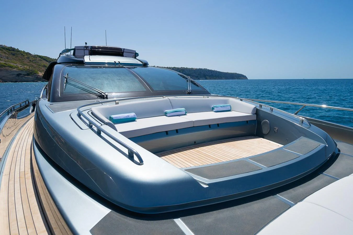 The yacht's foredeck features a spacious sunbathing area with plush cushions, perfect for relaxation. aboard ACQUA Yacht for Sale