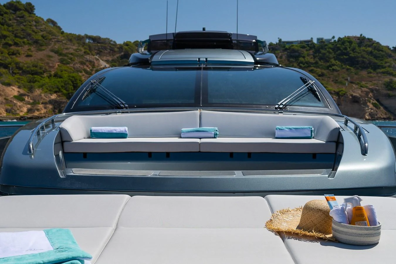 The yacht's aft deck offers a luxurious sunbathing area with scenic views of the surrounding landscape. aboard ACQUA Yacht for Sale