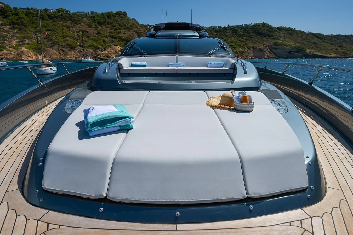 The foredeck features a spacious sunpad with towels and refreshments, perfect for relaxation. aboard ACQUA Yacht for Sale
