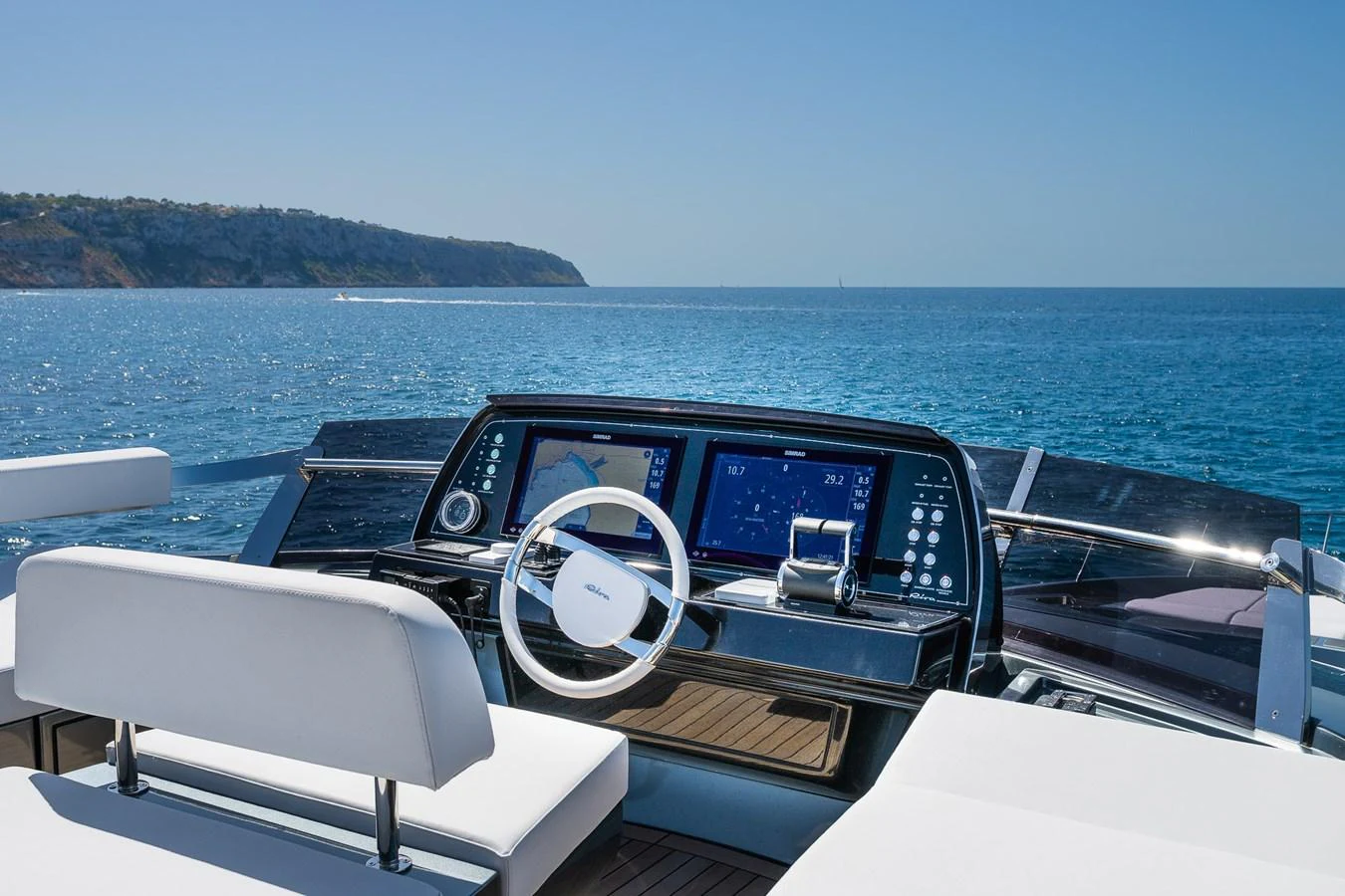The yacht's helm offers a sleek and modern control station with a stunning ocean view. aboard ACQUA Yacht for Sale
