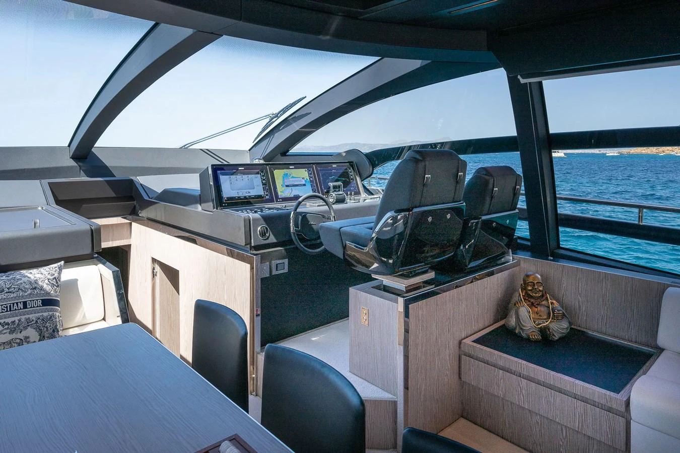 The helm station offers a sleek and modern design with advanced navigation equipment and comfortable seating. aboard ACQUA Yacht for Sale