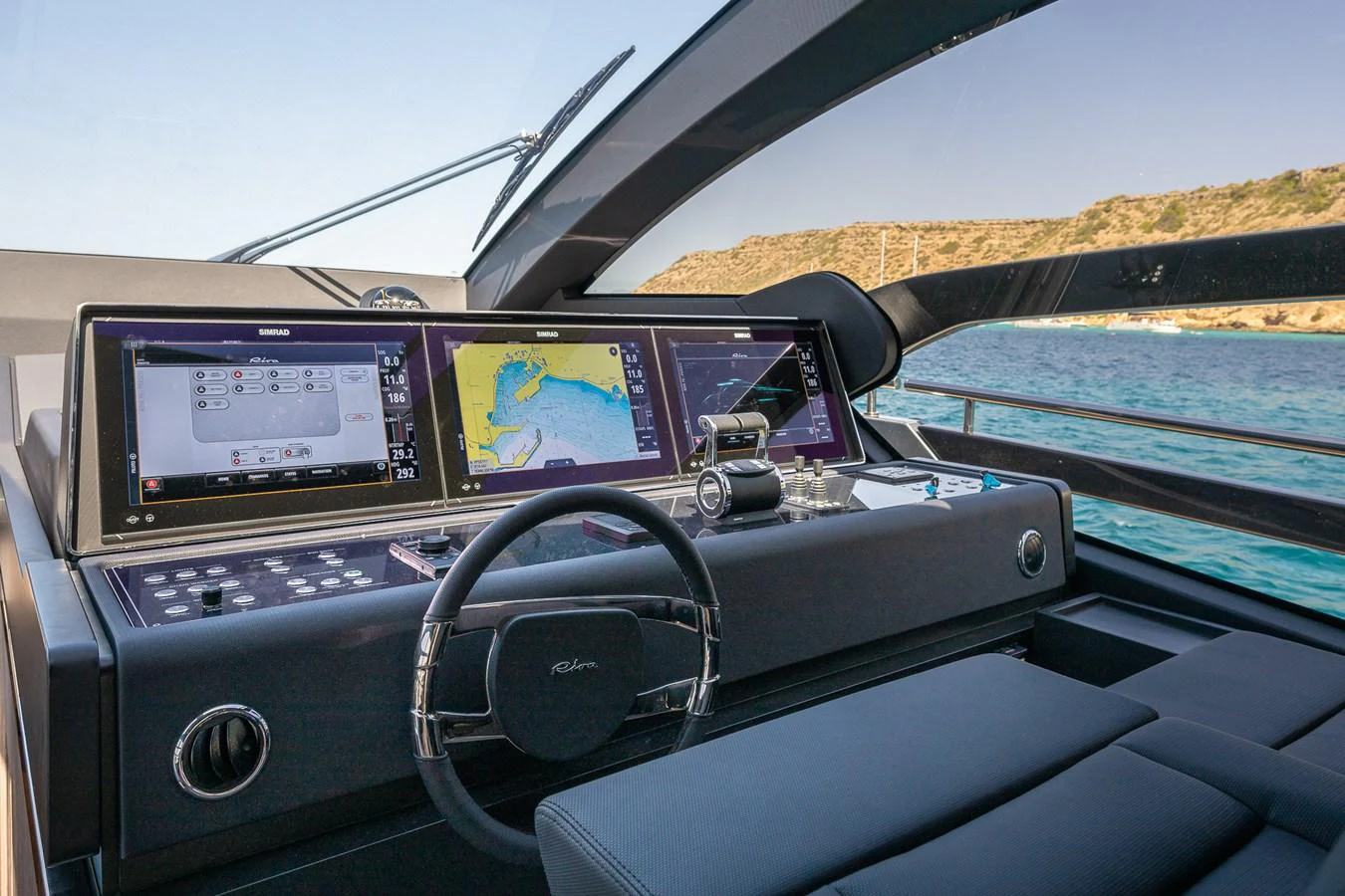The helm station features advanced navigation systems and a sleek, modern design. aboard ACQUA Yacht for Sale