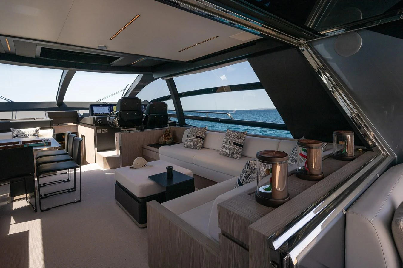 The salon offers a luxurious and spacious seating area with panoramic ocean views. aboard ACQUA Yacht for Sale