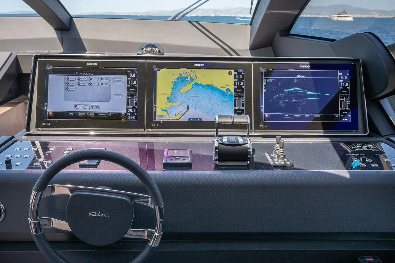 The helm station features advanced navigation systems and a sleek, modern design. aboard ACQUA Yacht for Sale