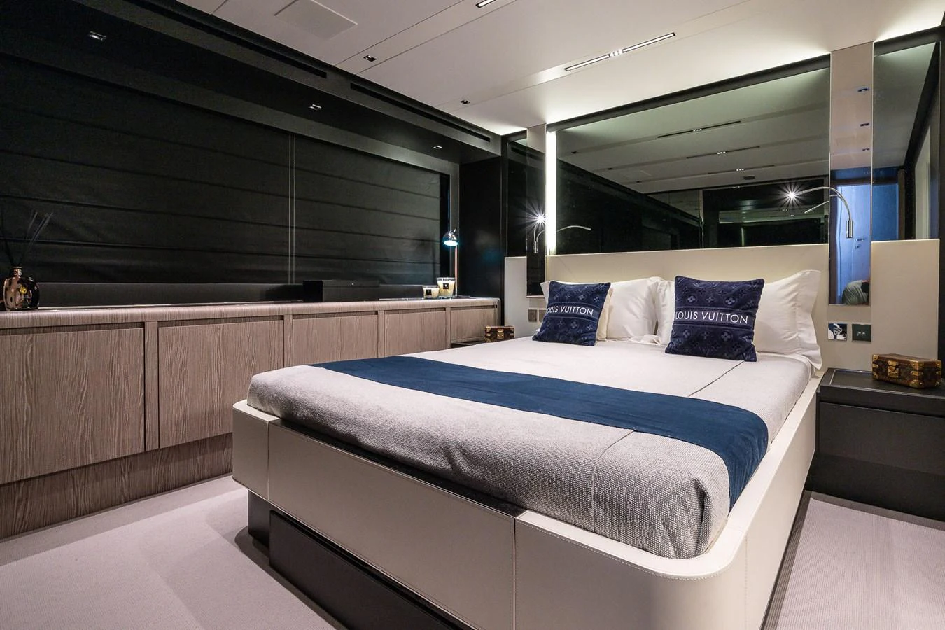 This luxurious stateroom features a modern design with a plush bed and elegant decor. aboard ACQUA Yacht for Sale
