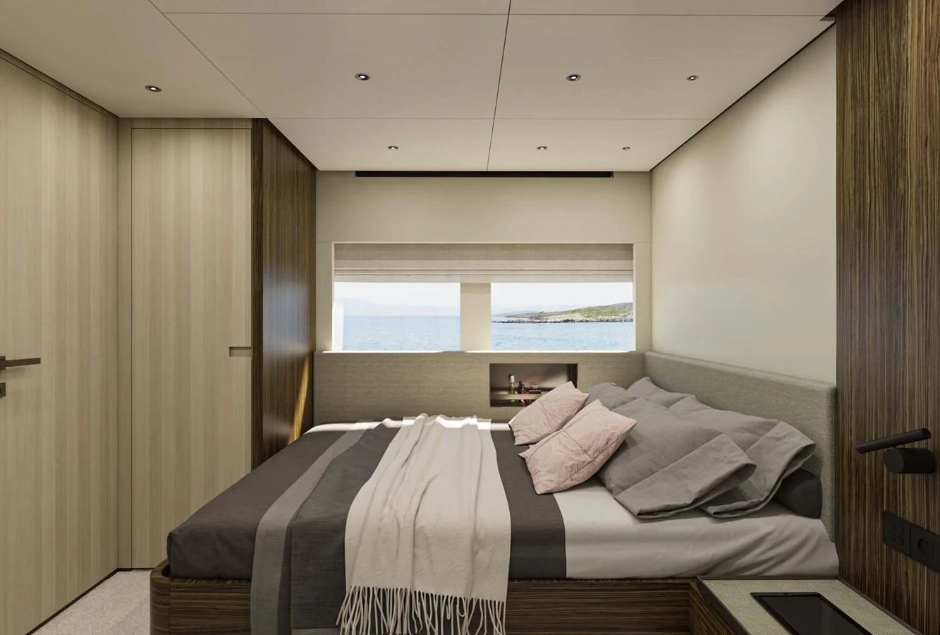 A luxurious stateroom with a large bed and a view of the sea through a window. aboard MANDAYACHT S 07 BERLINETTA Yacht for Sale
