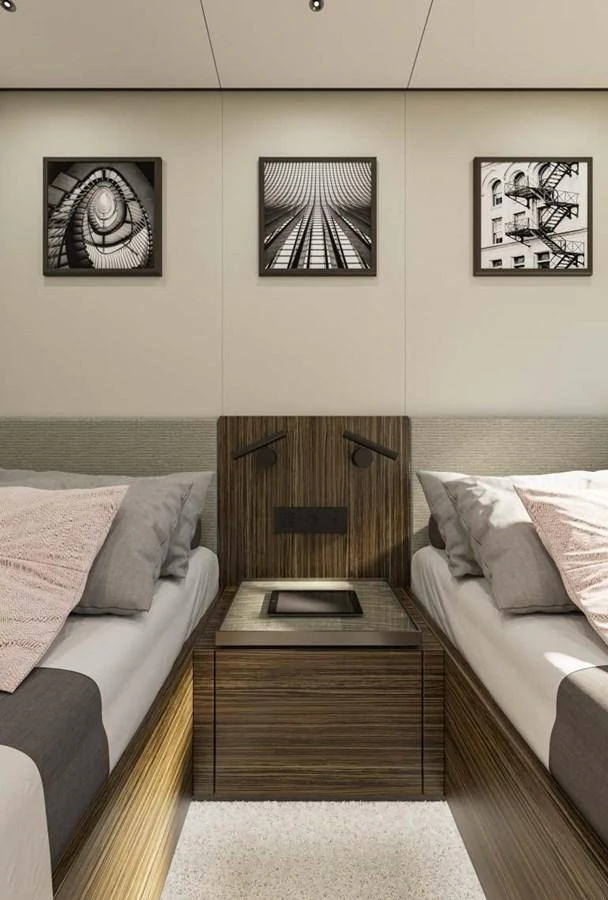The stateroom features twin beds with modern decor and artistic wall art. aboard MANDAYACHT S 07 BERLINETTA Yacht for Sale