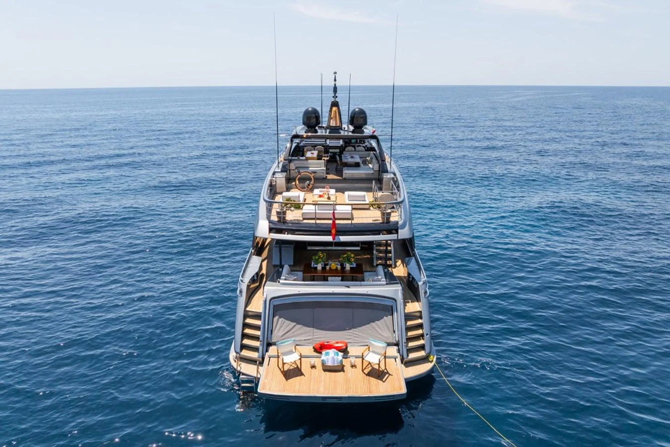The yacht's aft deck offers a luxurious space for relaxation and entertainment on the open sea. aboard JANETTE Yacht for Sale