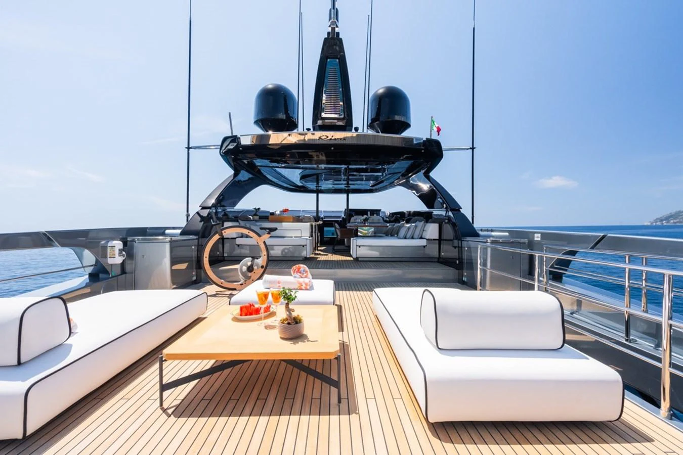 The flybridge offers a luxurious open-air space with modern seating and a stunning ocean view. aboard JANETTE Yacht for Sale