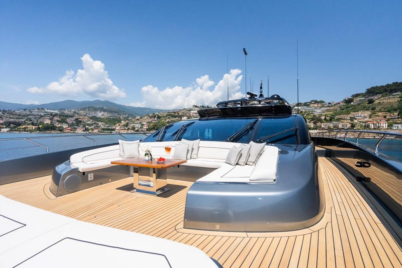 The foredeck features a spacious seating area with a table, perfect for enjoying the scenic views. aboard JANETTE Yacht for Sale