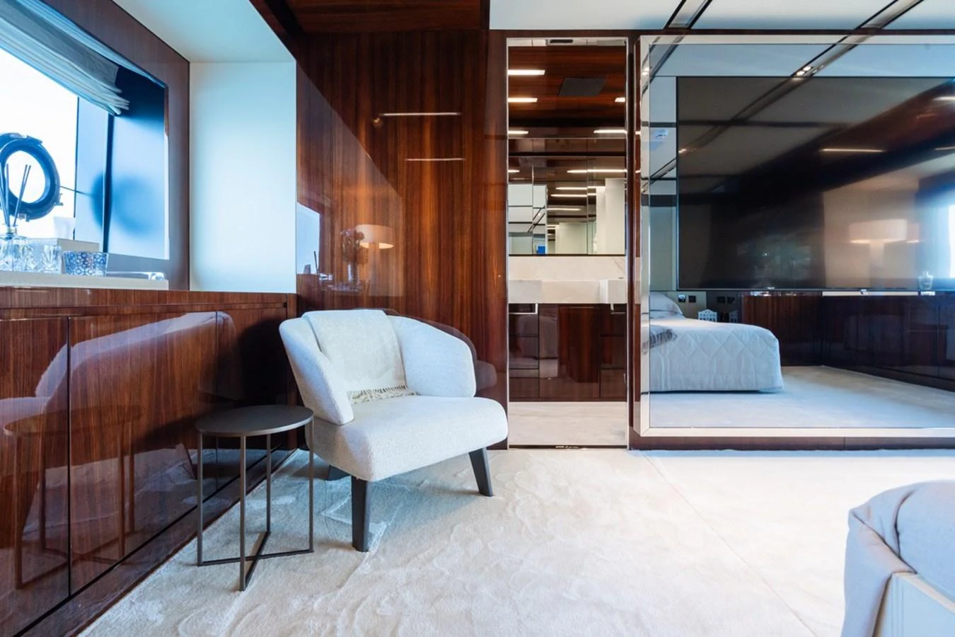 The yacht's interior features a cozy seating area with modern furnishings and a large flat-screen TV. aboard JANETTE Yacht for Sale