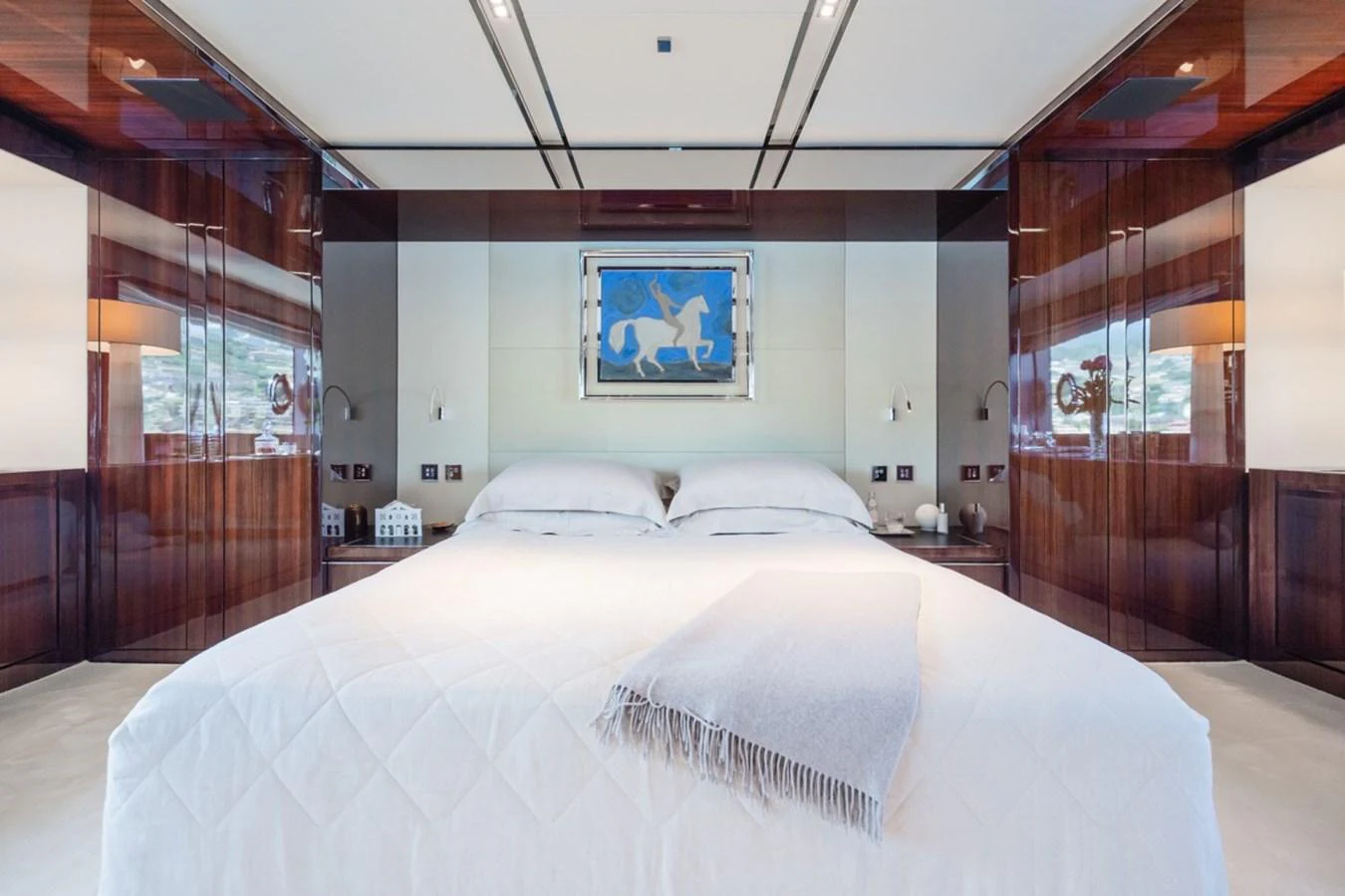 The master stateroom features a luxurious bed with elegant decor and ample natural light. aboard JANETTE Yacht for Sale