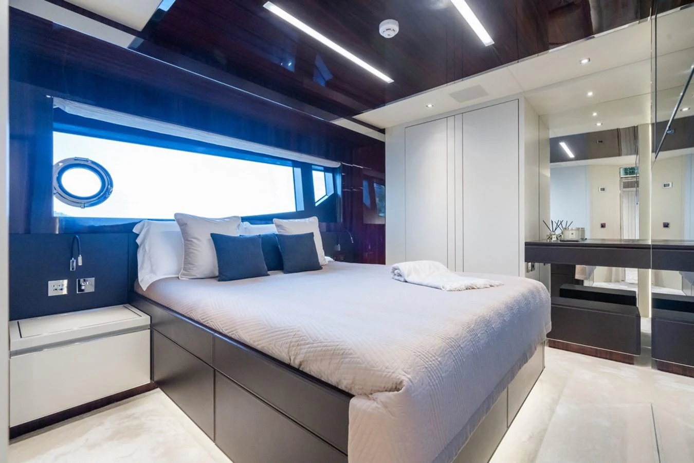 The master stateroom features a luxurious bed with modern furnishings and ample natural light. aboard JANETTE Yacht for Sale