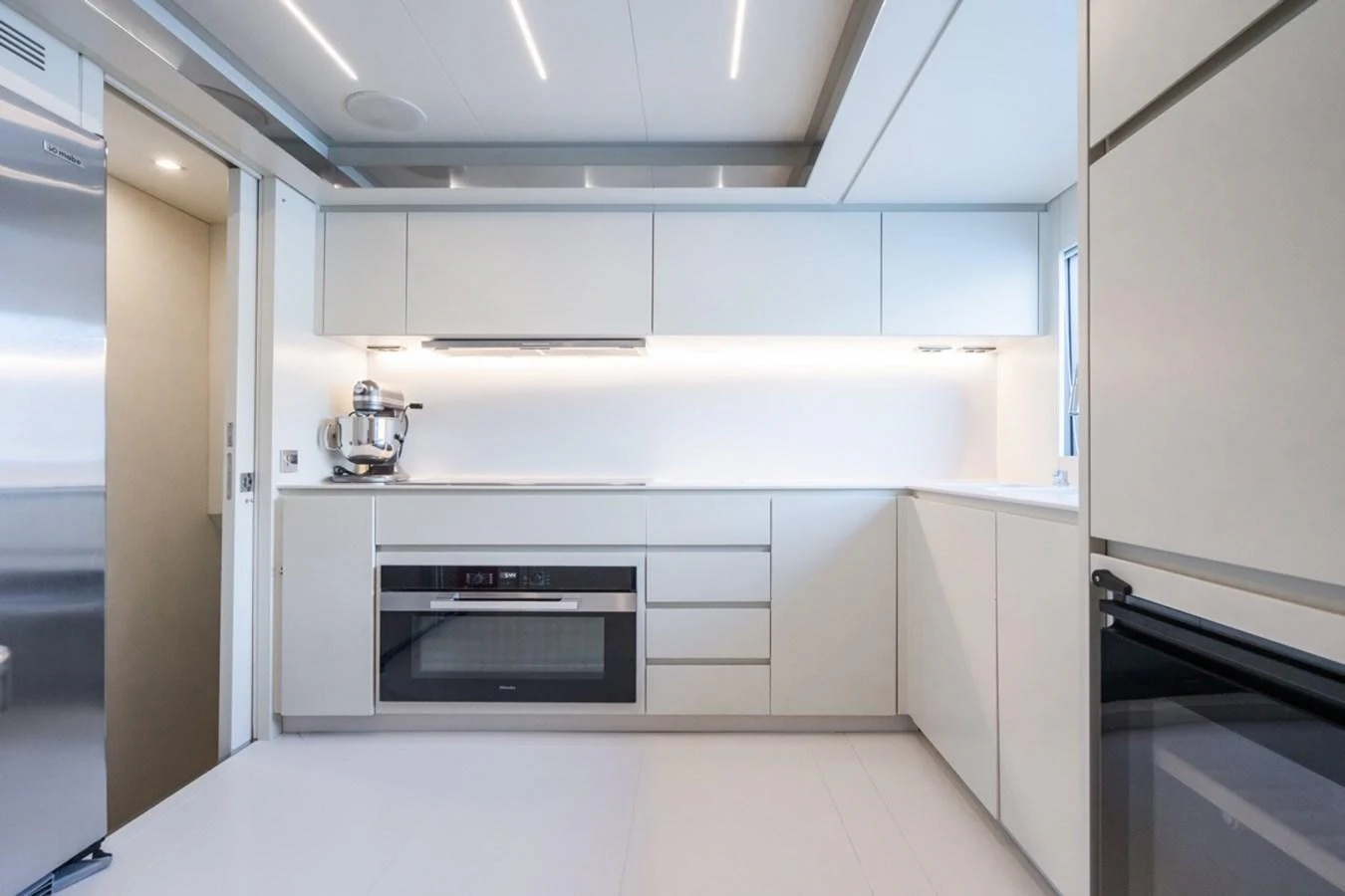 The galley features sleek, modern cabinetry and state-of-the-art appliances. aboard JANETTE Yacht for Sale