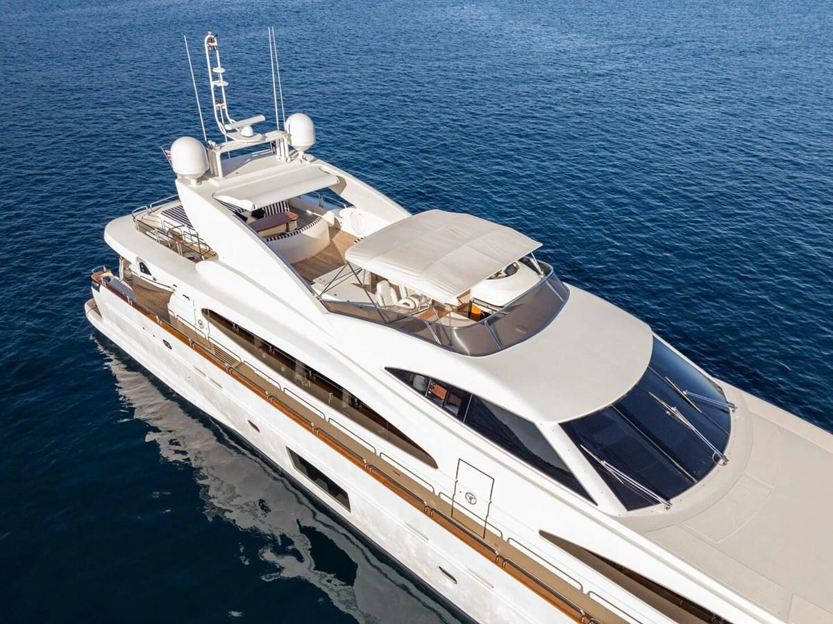 A sleek and modern yacht cruising on calm blue waters. aboard SPRING TIDE Yacht for Sale