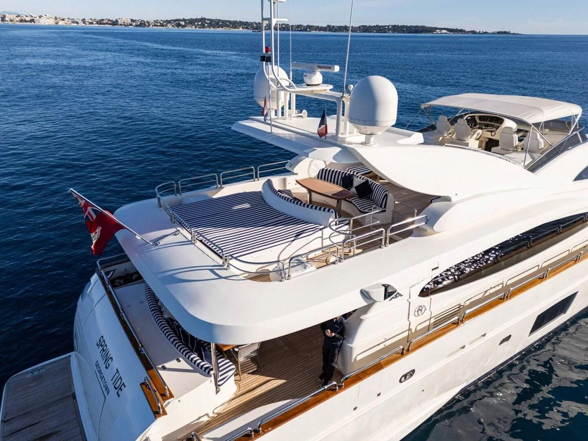 This elegant yacht features a spacious aft deck with luxurious lounging areas, perfect for relaxation and entertainment. aboard SPRING TIDE Yacht for Sale