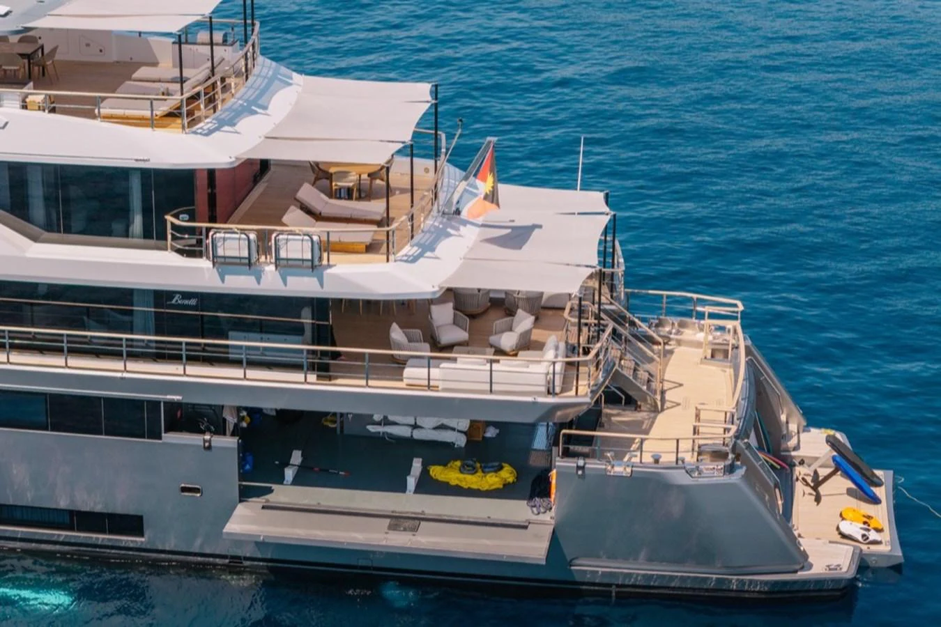 The yacht's aft deck features multiple lounging areas and water toys, perfect for relaxation and fun on the water. aboard RAISA Yacht for Sale